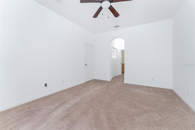 carpeted spare room featuring ceiling fan