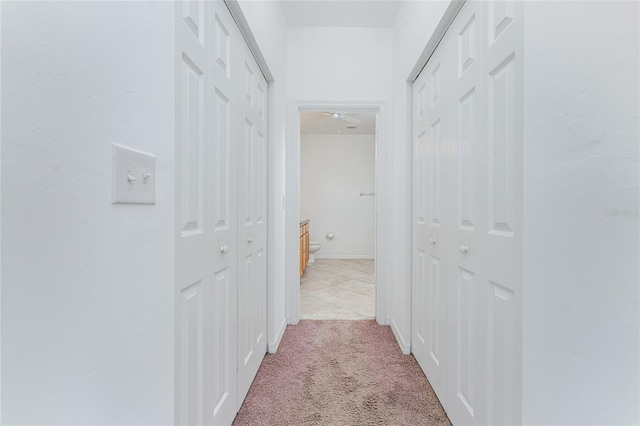 hallway with light carpet