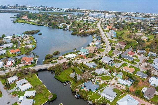 drone / aerial view with a water view