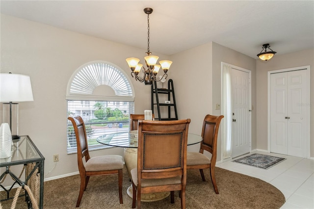 tiled dining space with a notable chandelier