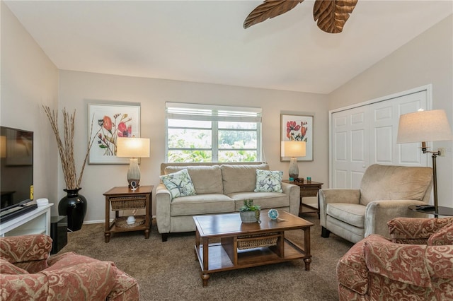 carpeted living room featuring ceiling fan and lofted ceiling