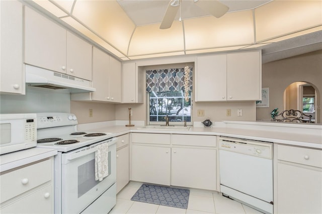 kitchen featuring sink, white appliances, and white cabinets