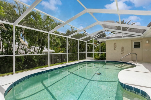 view of pool featuring a lanai and a patio