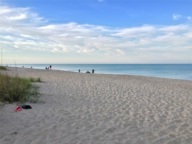 view of water feature with a beach view