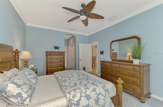 bedroom with light carpet, ornamental molding, a closet, and ceiling fan