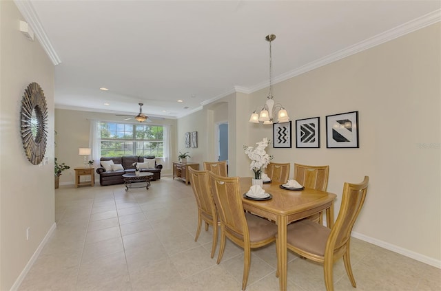 tiled dining room featuring crown molding and ceiling fan with notable chandelier