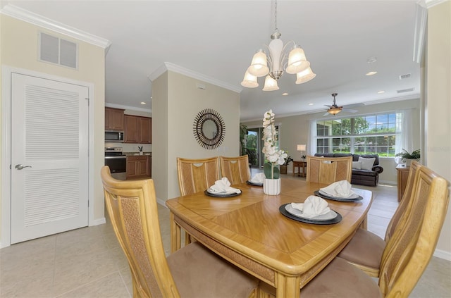 tiled dining area featuring ornamental molding and ceiling fan with notable chandelier