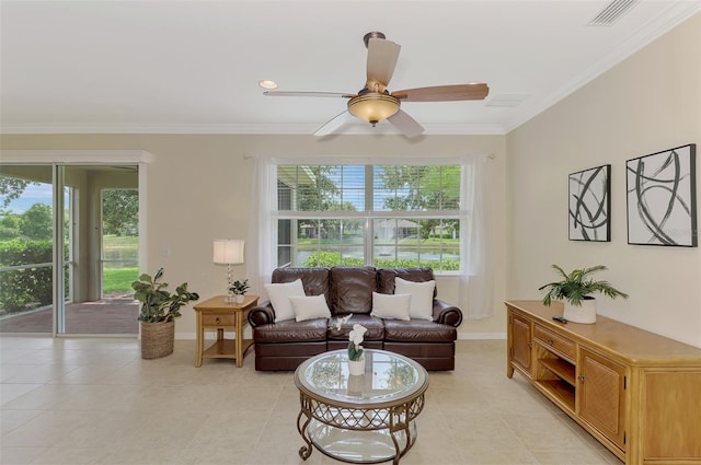 living room with crown molding, ceiling fan, and light tile patterned floors