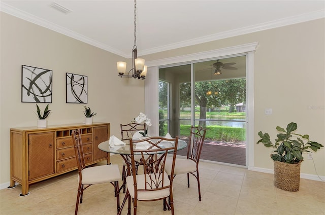 tiled dining room featuring ornamental molding and a chandelier