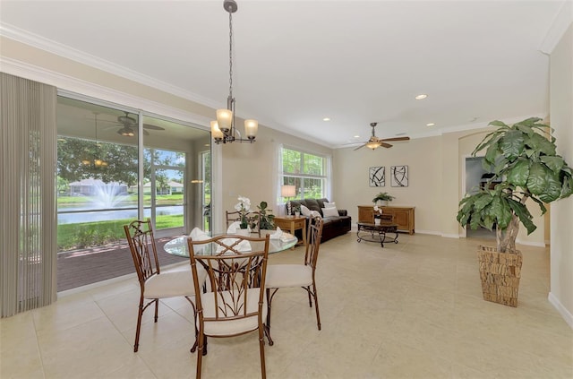 dining space with crown molding and ceiling fan