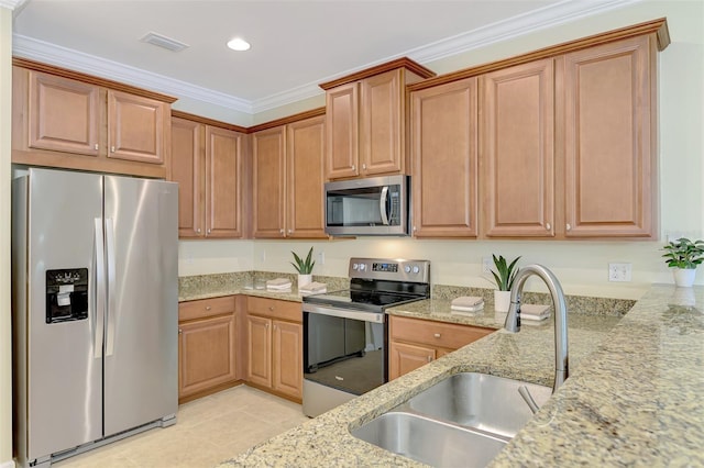 kitchen with stainless steel appliances, sink, light tile patterned floors, and light stone counters