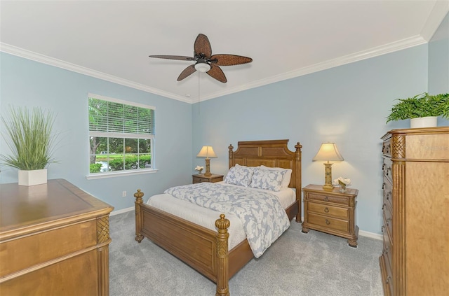 bedroom featuring ornamental molding, light carpet, and ceiling fan