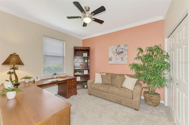 office with crown molding, light carpet, and ceiling fan