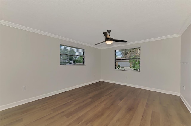 spare room featuring hardwood / wood-style floors, ornamental molding, and ceiling fan