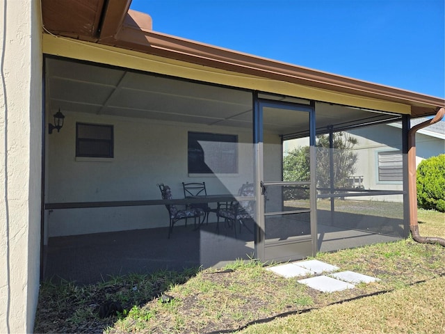 view of patio / terrace featuring a sunroom