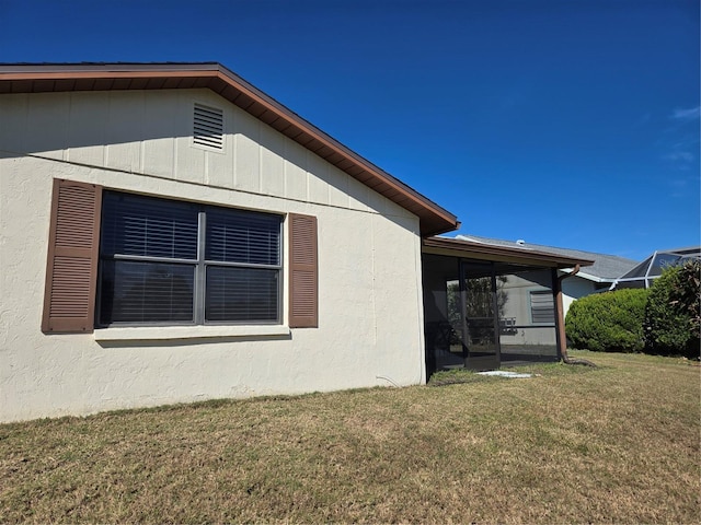 view of property exterior featuring a lawn