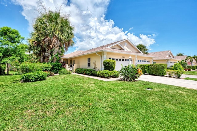 view of front of property with a garage and a front yard