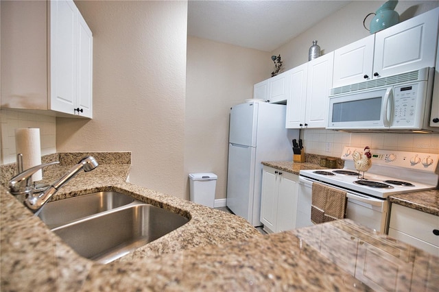 kitchen featuring sink, white cabinetry, white appliances, and backsplash