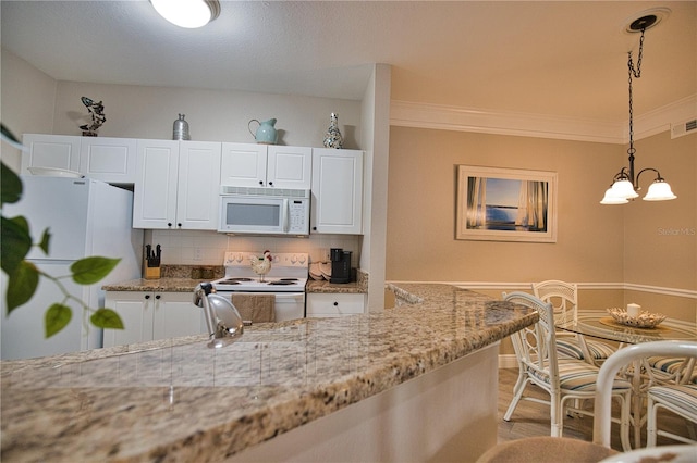 kitchen featuring light hardwood / wood-style flooring, white appliances, white cabinets, decorative backsplash, and crown molding