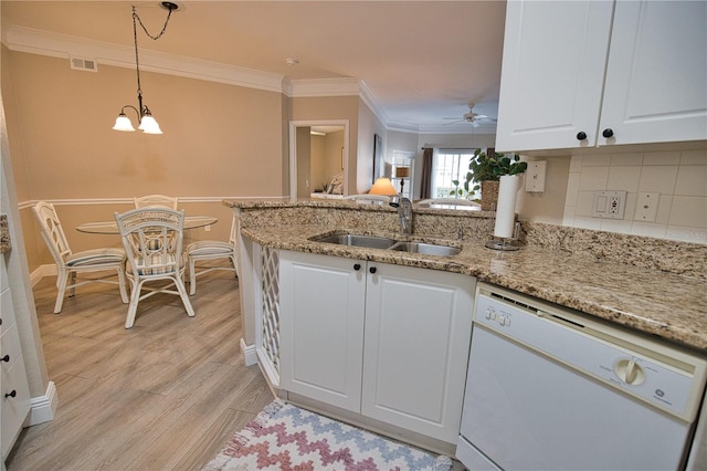 kitchen with decorative backsplash, dishwasher, white cabinets, and light hardwood / wood-style floors