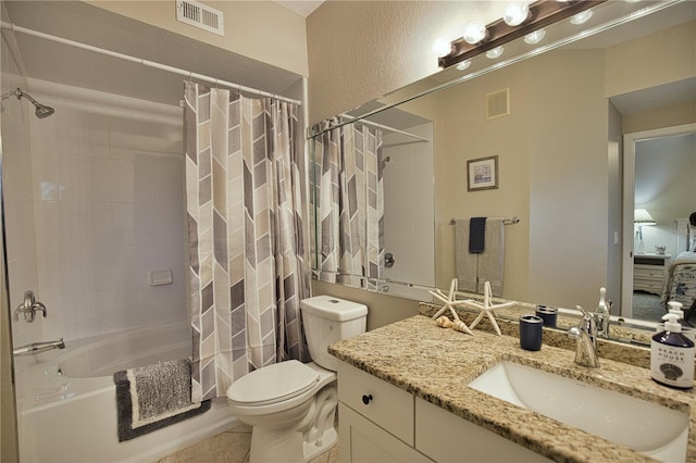 full bathroom with vanity, toilet, and shower / bath combo with shower curtain