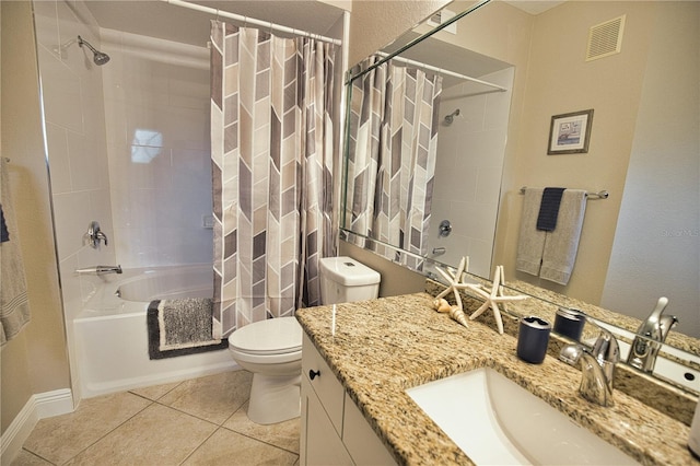 full bathroom with tile patterned flooring, shower / bath combo with shower curtain, toilet, and vanity