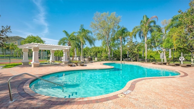 view of pool with a pergola and a patio area