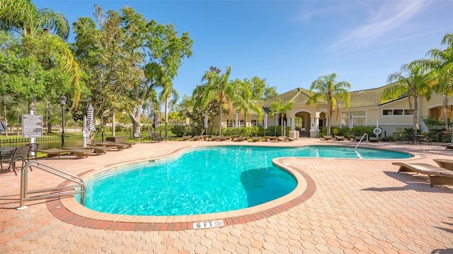 view of swimming pool with a patio area