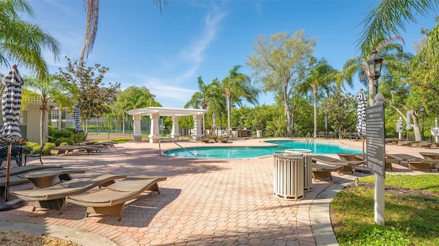 view of pool with a pergola and a patio