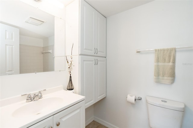 bathroom with vanity and toilet