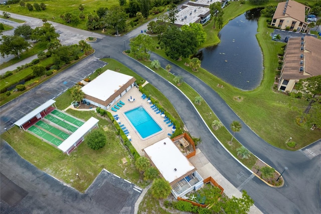 birds eye view of property with a water view