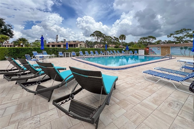 view of pool featuring a patio