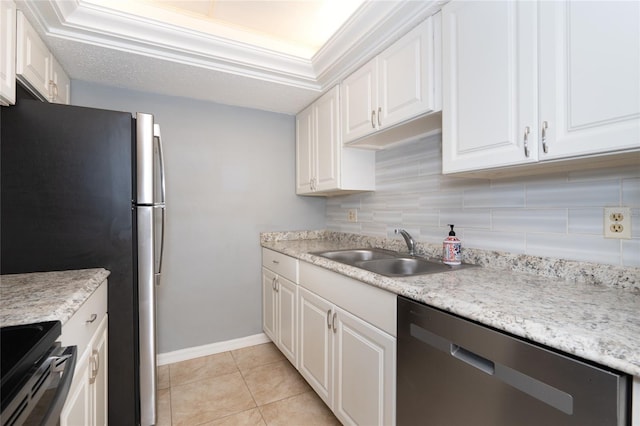 kitchen featuring stainless steel appliances, white cabinets, decorative backsplash, ornamental molding, and sink