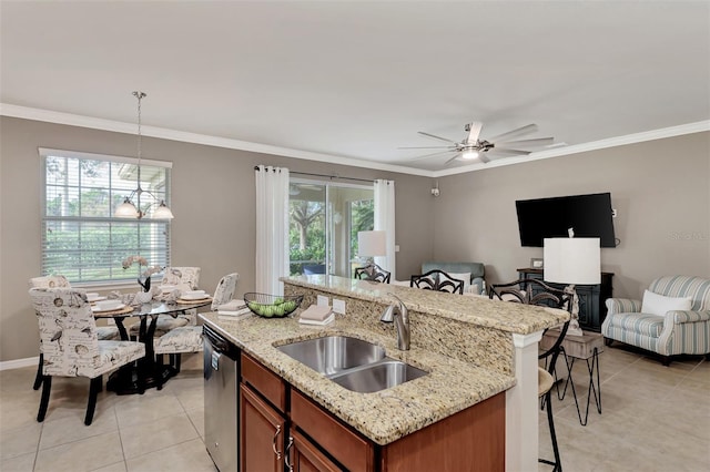 kitchen featuring light tile patterned floors, a wealth of natural light, and sink