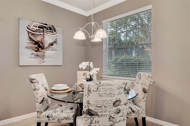 tiled dining area featuring crown molding and a chandelier