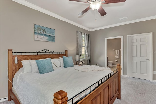 carpeted bedroom featuring ensuite bathroom, crown molding, and ceiling fan