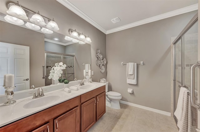 bathroom featuring tile patterned flooring, a shower with door, crown molding, dual bowl vanity, and toilet