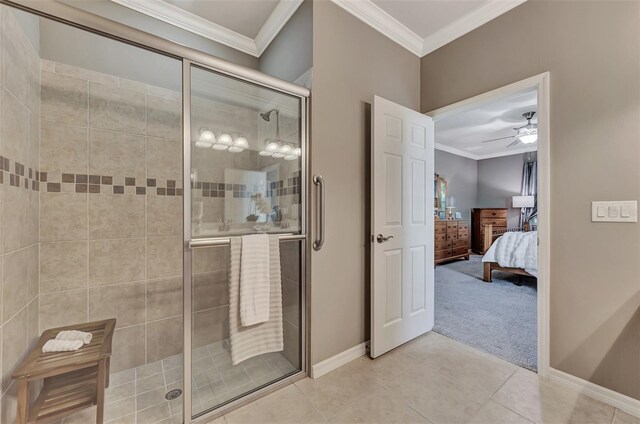 bathroom with a shower with door, tile patterned flooring, ceiling fan, and ornamental molding