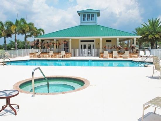 view of pool with a patio area and a hot tub