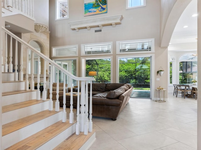 interior space featuring recessed lighting, a high ceiling, and tile patterned floors