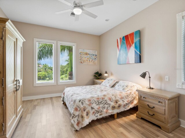 bedroom featuring ceiling fan and light hardwood / wood-style flooring