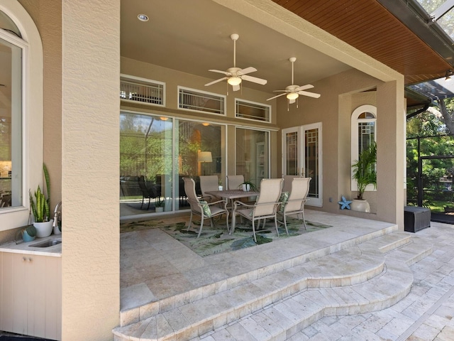 view of patio / terrace featuring ceiling fan and a sink