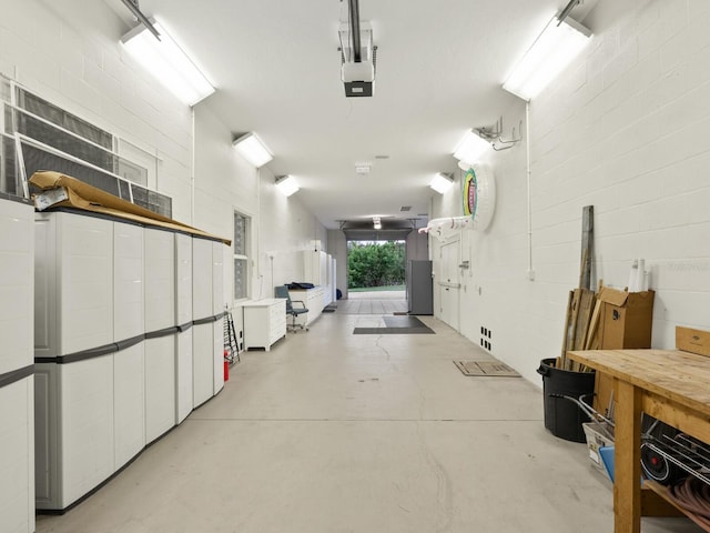 garage with concrete block wall