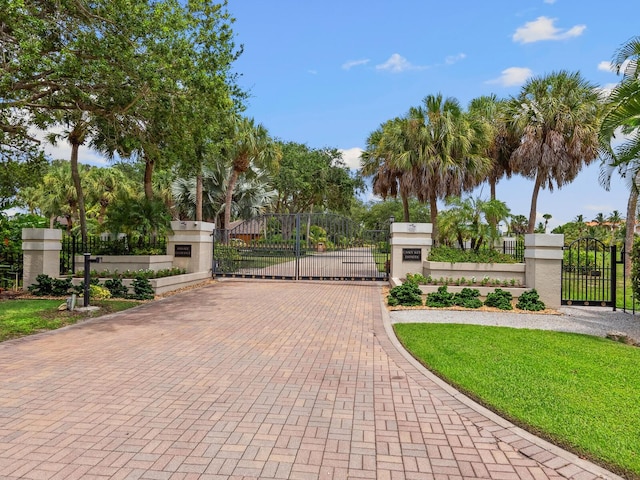 view of gate with fence