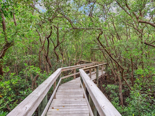 dock area featuring a wooded view