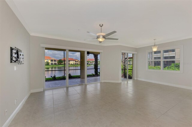 spare room with ornamental molding, a water view, light tile patterned floors, and ceiling fan