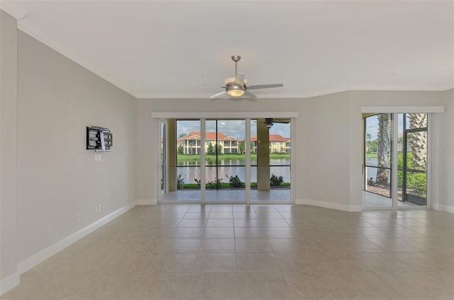 empty room with a water view, plenty of natural light, and ornamental molding