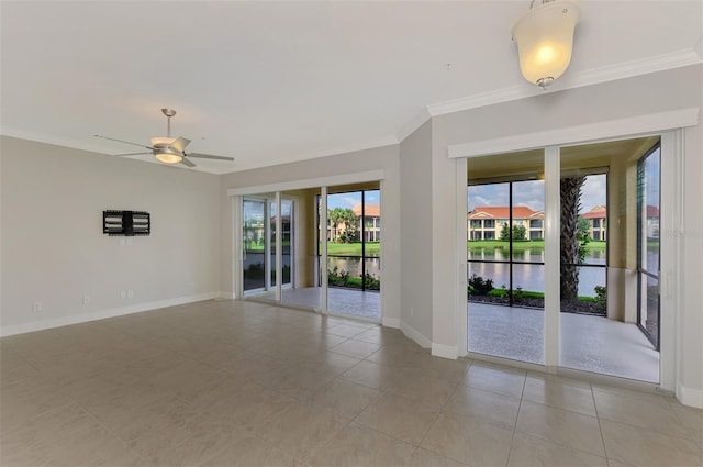 tiled empty room featuring a water view, ceiling fan, and ornamental molding