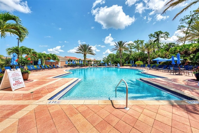 view of swimming pool featuring a patio