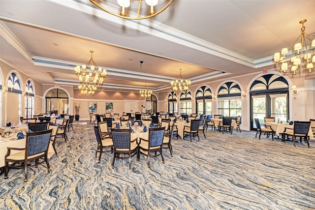 dining room featuring carpet flooring, a tray ceiling, and ornamental molding